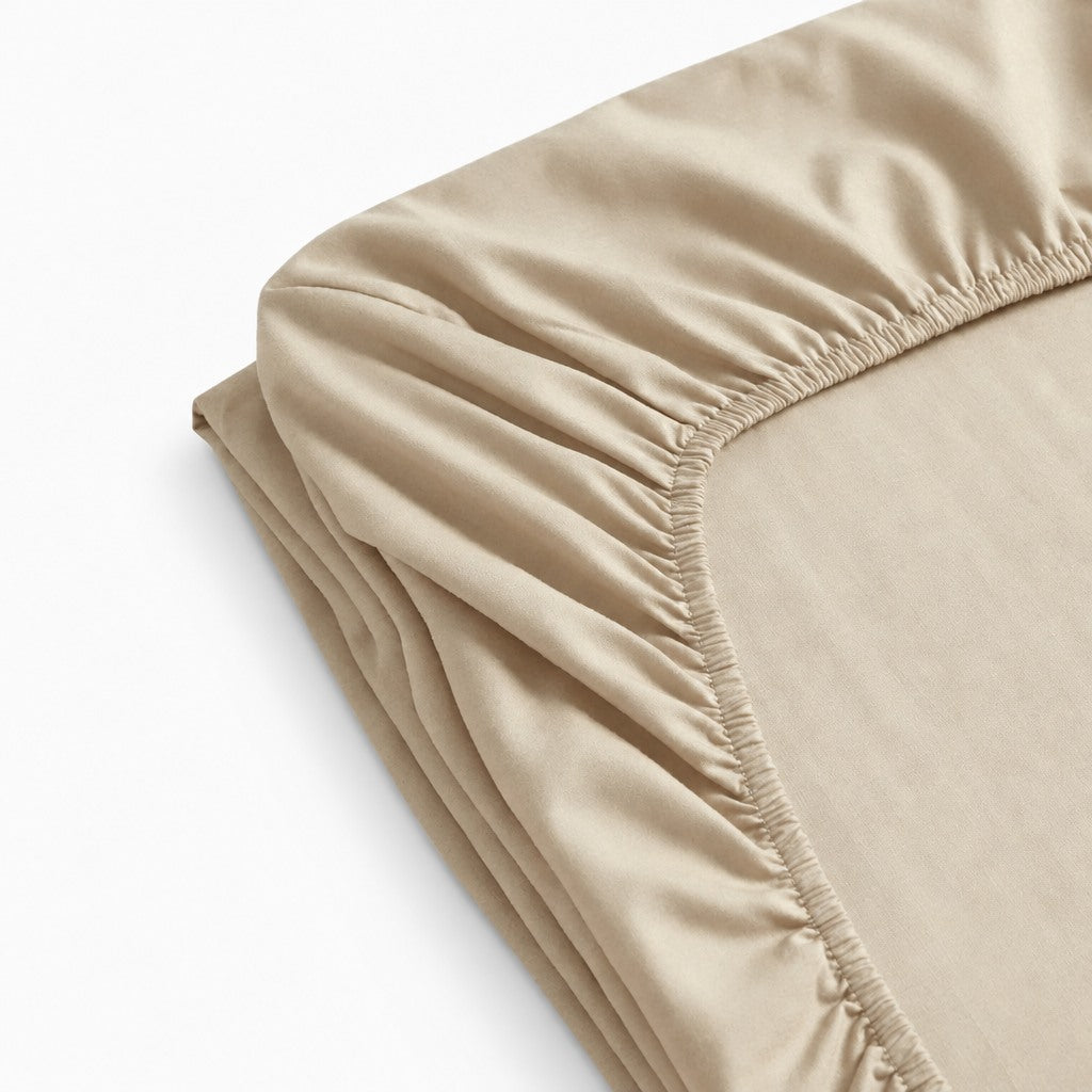 Drap-housse 100 % coton jersey doux et extensible, maintien parfait sur matelas, tailles variées.