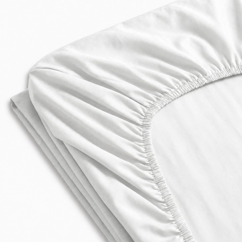 Drap-housse extensible en jersey 100 % coton, doux et confortable, maintien parfait sur matelas.
