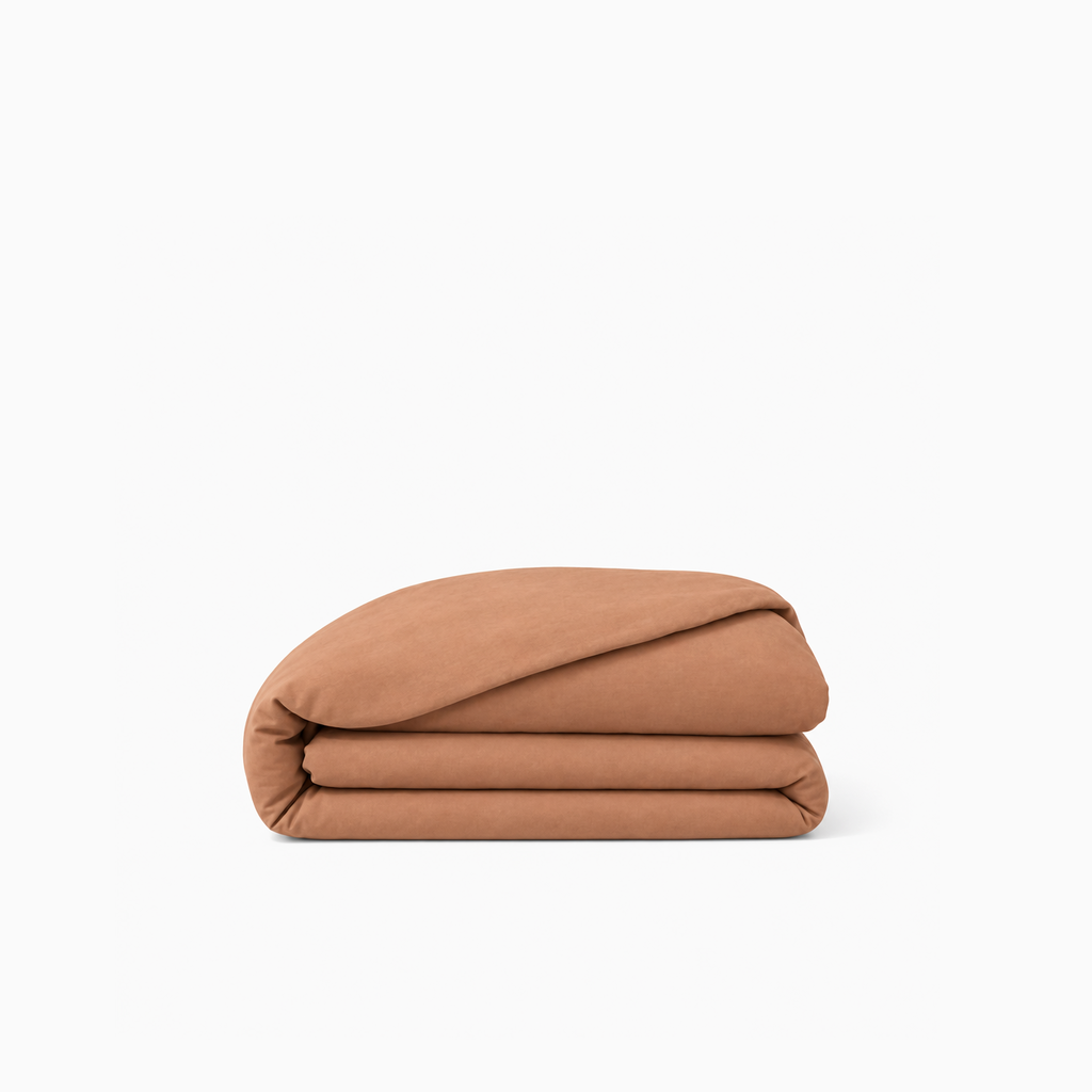 Housse de couette unie en percale de coton, texture lisse et fraîche, élégance sobre et durable