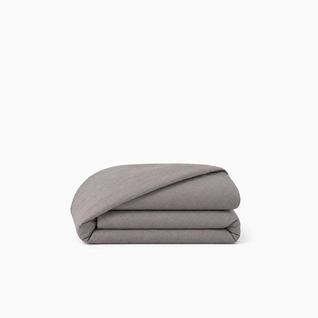 Housse de couette percale de coton unie, texture lisse et respirante, finition élégante et durable.