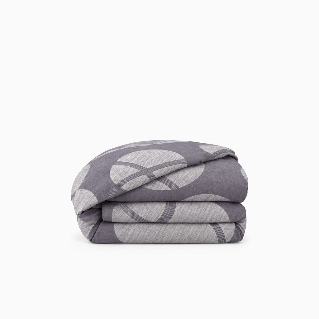 Housse de couette en polycoton renforcé, résistante et douce, idéale pour un confort durable et un entretien facile.