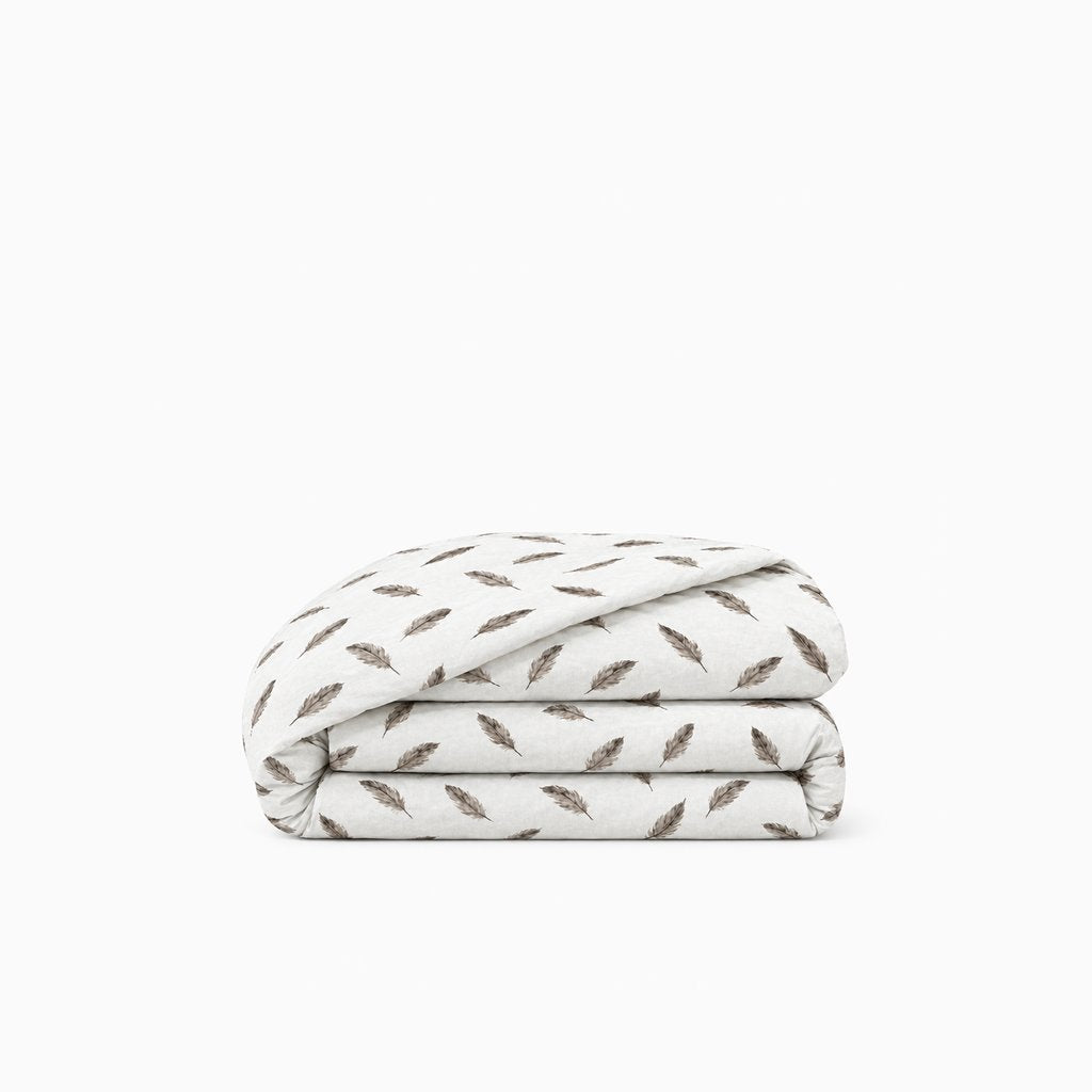 Housse de couette polycoton renforcé, douce et résistante, facile à entretenir pour un lit confortable et moderne.