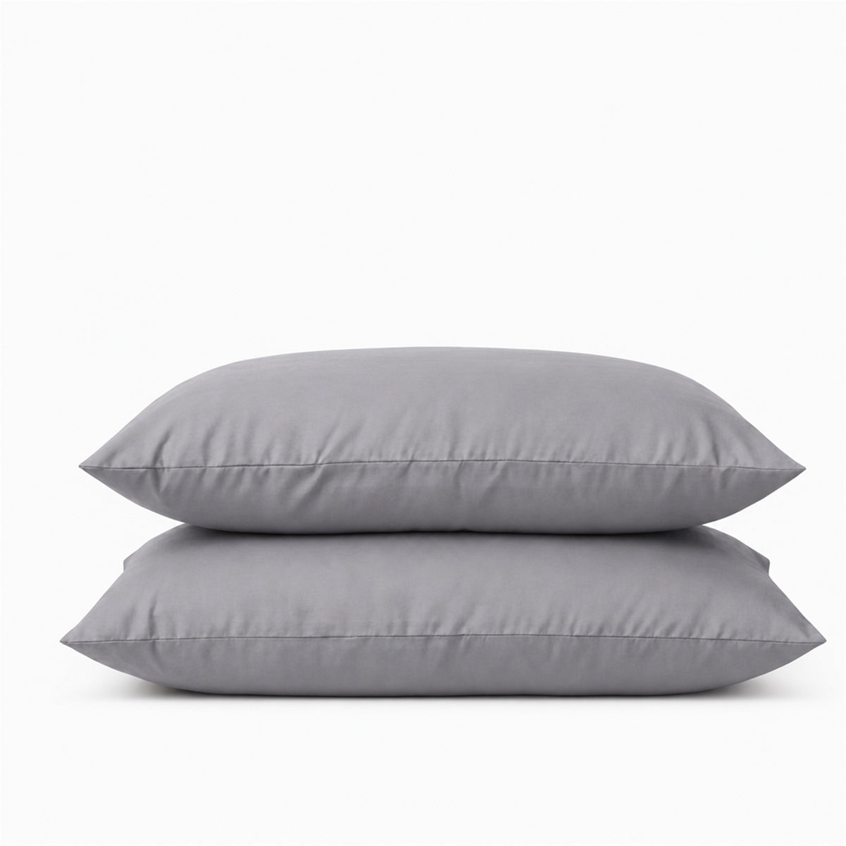 Deux taies d'oreiller en percale de coton 100 fils/cm², texture lisse et fraîcheur naturelle, confection européenne de haute qualité